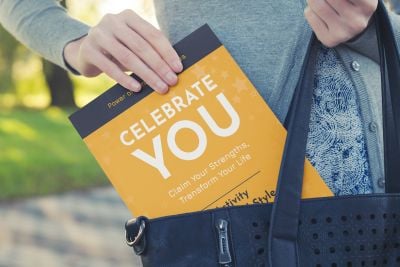 Bookstore aisle selling the book titled Celebrate You!