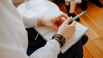 A coach taking notes during a session