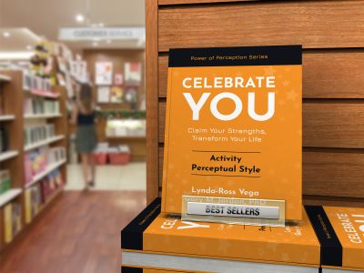 Bookstore aisle selling the book titled Celebrate You!